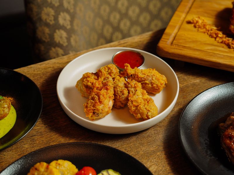 Via 313 crispy chicken wings with house hot sauce